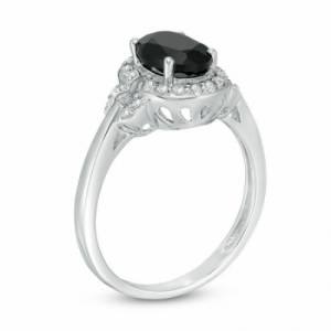 Женское кольцо из серебра с ониксом и топазами