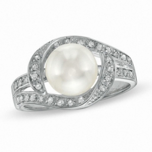 Женское кольцо из серебра с жемчугом и топазами
